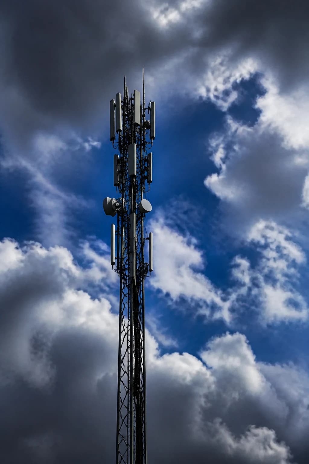 Cell tower against a cloudy sky